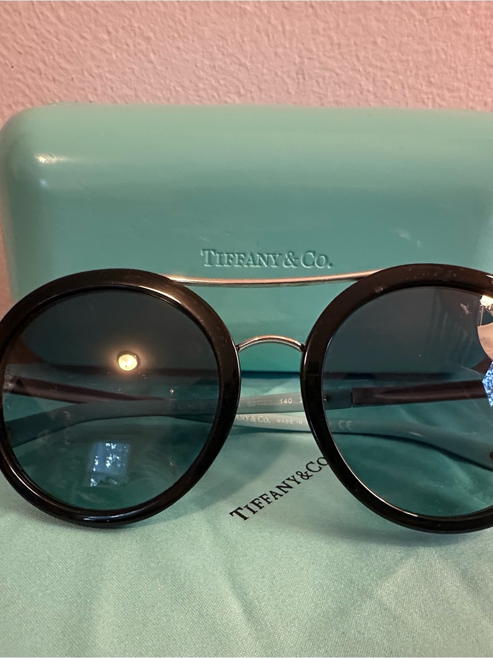 Tiffany & Co. Round Black Frame Sunglasses with Blue Lenses
